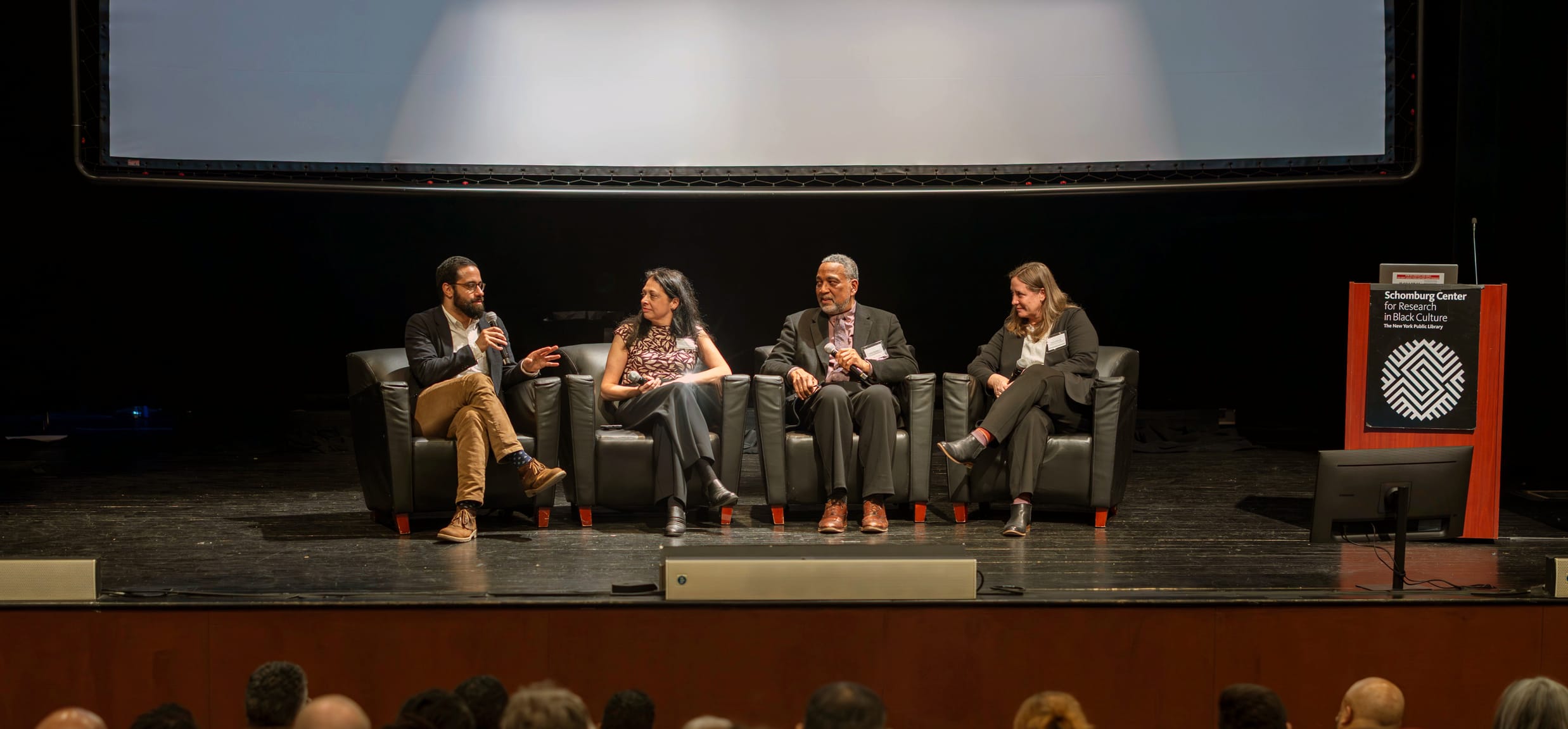 On stage at the Schomburg, from left to right: Salmaan Khan, Lane Addonizio, John Reddick, Jessica MacLean.